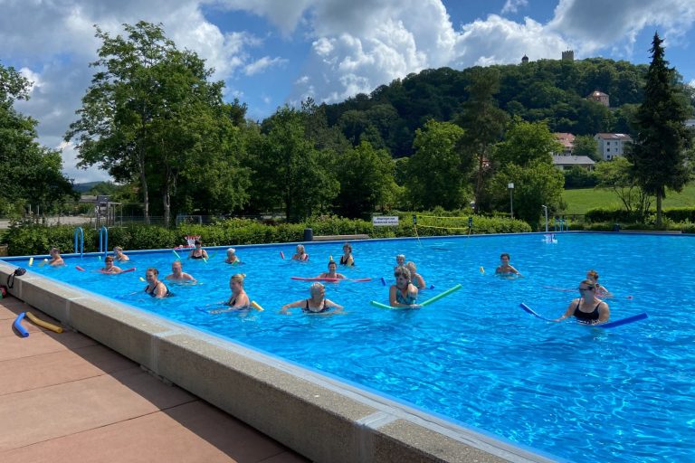 An excersise group doing aqua fitness