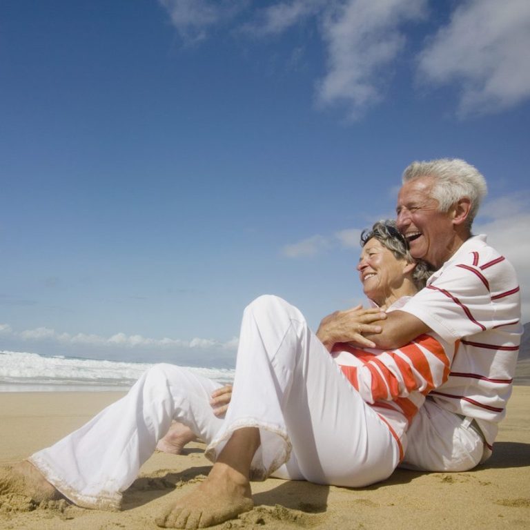 Two elderly people enjoying life and smiling